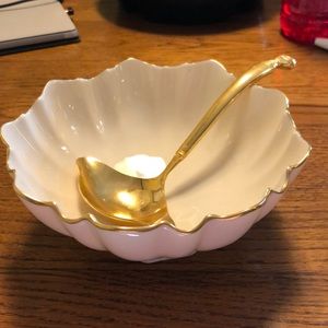 Ivory bowl trimmed in gold with gravy ladle